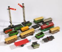 Collection of tinplate model railway carriages and rolling stock, to include Baxtoy and Chad Valley,