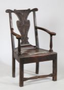 18th century oak open elbow chair, having scrolling back rail and heart shaped splat with floral