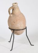 Terracotta vessel, of ovoid form with handle, on metal three legged stand, the vessel approx. 50cm