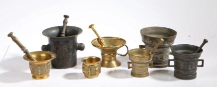 Collection of seven various cast metal mortars, all 20th century, with five pestles, the largest