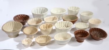 Collection of mostly Victorian stoneware and pottery jelly moulds, various shapes and sizes (20)