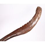 Soloman Islands dance paddle, with a crescent blade and slightly jagged edge, 99cm long