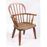 Child's elm seated windsor chair, thew lopped back rail with spindles, raised on four turned legs,
