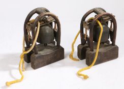 Two Chinese temple bells, in arched frames, 20cm high, (2)