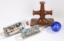 A small collection of maritime items, to include two ships in bottles, a witches ball and a