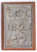 19th century maritime lead plaque, with the initials SC and dated 1821 above an anchor, mounted on