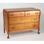 Continental oak bombe chest, fitted three long graduating drawers and raised on paw feet, 116cm