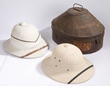 A Naval officers white pith helmet by Gieves Ltd. 21 Old Bond St. London, the white helmet with