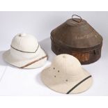 A Naval officers white pith helmet by Gieves Ltd. 21 Old Bond St. London, the white helmet with