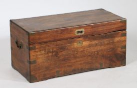 19th century teak and brass bound chest, the hinged lid with sunken brass handle, enclosing a