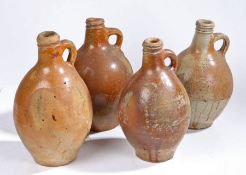 Four 18th/19th Century stoneware bottles, one example etched with the initials A CP, another