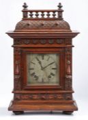 Early 20th century oak cased mantle clock, the architectural case with a single glazed door