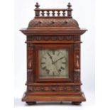 Early 20th century oak cased mantle clock, the architectural case with a single glazed door