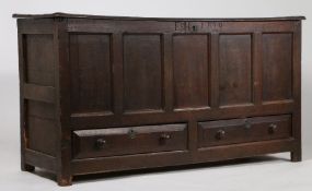 18th century oak mule chest, the panelled front initialled E,H. and dated 1729, fitted two drawers