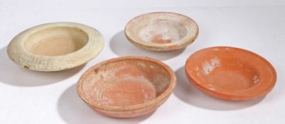 Roman pottery, three dished bowls, 18cm diameter to 20.5cm diameter, together with a white pottery