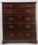 George III oak chest of drawers, fitted two short over four long graduating drawers, in two parts,