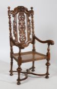 17th century style walnut open arm carver chair, with pierced floral splats and carved acanthus leaf