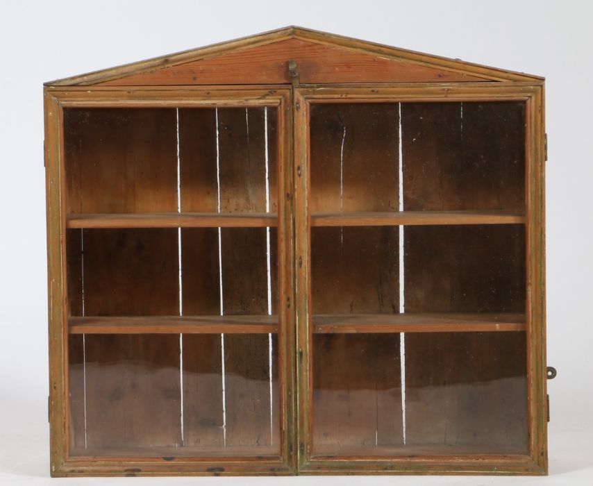 Victorian pine and glazed wall cabinet, having arched pediment above a pair of glazed doors
