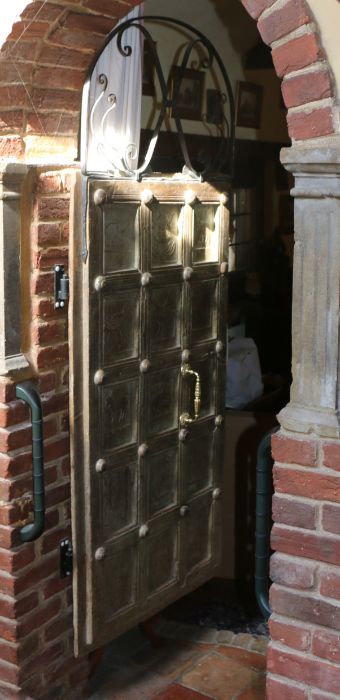 An Indian hardwood door, the wrought iron scrolled arch top above a fifteen panelled door, each - Image 2 of 3