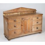 Victorian pine sideboard, having arched gallery above an arrangement of six drawers and centred with