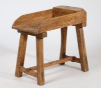 Unusual stripped pine side table, with rectangular galleried top, raised on square legs united by