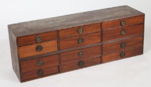 Victorian mahogany bank of twelve drawers, each with loop handle, 92.5cm wide, 32cm high, 25cm deep