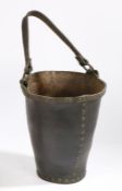 A George III leather fire bucket, with a copper rim, 29cm high