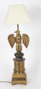 A decorative brass table lamp with eagle mount, 65cm height