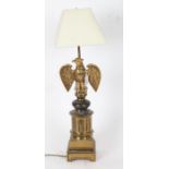 A decorative brass table lamp with eagle mount, 65cm height