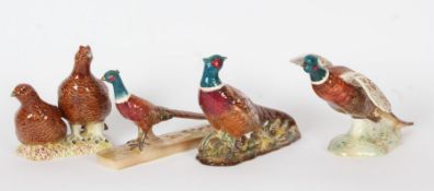 Two Beswick pottery models of Pheasant (No 850 & 1774), a further pheasant and a pair of Partridge