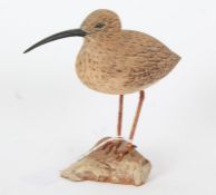 A small wooden carving of a wading bird, 16cm height