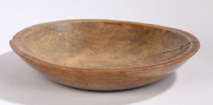 A large 19th Century sycamore bowl, dug our with a flat lip, 48cm diameter