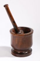 A lignum vitae pestle and mortar, of baluster form, the mortar 19cm high, the pestle 35cm high, (2)