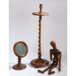 A 19th Century candle stand, with a candle holder above a barley twist column and turned base,