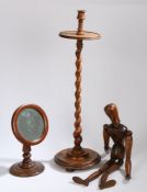 A 19th Century candle stand, with a candle holder above a barley twist column and turned base,