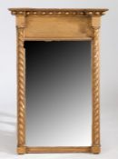 A Regency pier mirror, the concave and ball cornice above a rectangular mirror plate and twist