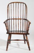 An early 19th Century ash and elm Windsor chair, circa 1800-1810, West Country, the arched top