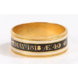 A 18 carat gold 19th Century mourning ring, with a white and black enamel band named to Lady