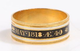 A 18 carat gold 19th Century mourning ring, with a white and black enamel band named to Lady