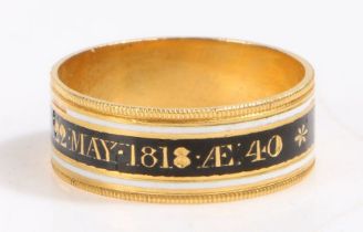 A 18 carat gold 19th Century mourning ring, with a white and black enamel band named to Lady