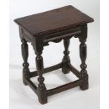 A Charles I and later oak joint stool, the base circa 1630, the later rectangular top above