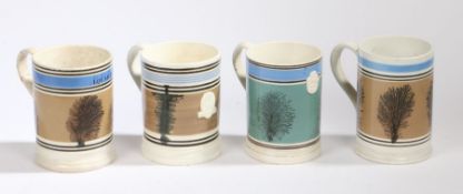 A collection of 19th Century Mocha ware tankards/mugs, with a tree design on a pale brown field