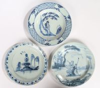 Three 18th Century Delft plates, circa 1740/1750, an English example painted in blue with a shepherd