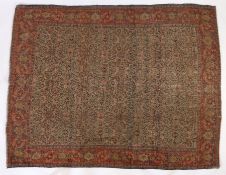 A Senneh rug, North West Iran, set with repeating Boteh petal guls, on a red cream and blue