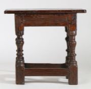 A part 17th Century oak joint stool, the rectangular top above rails and turned legs united by