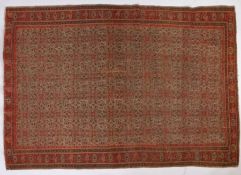A Senneh rug, North West Iran, set with repeating Boteh petal guls with repeating borders, with a