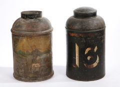 Two 19th Century Toleware tea cannisters, in black, the first with an Oriental figure in a