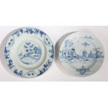 Two 18th Century Delft chargers, the first with an Oriental scene featuring two figures in a