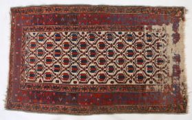 A Persian rug, with a Tulip motif together with multiple repeating borders, with a red blue and