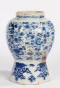 An early 18th Century Delft vase, circa 1700, of octagonal baluster form, painted in blue with a